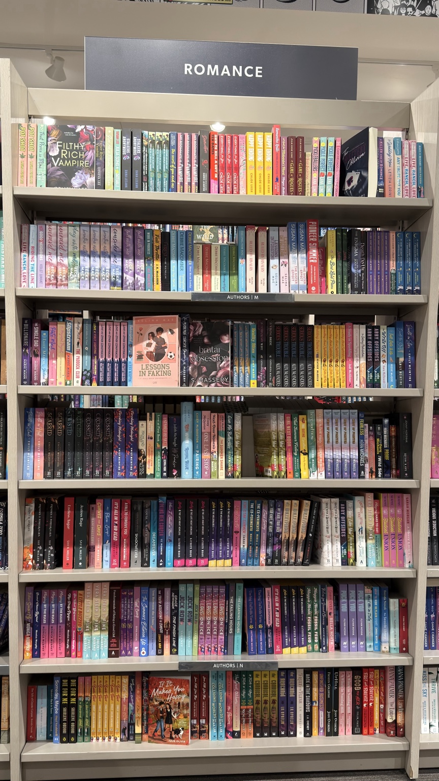 Colourful romance shelves photographed by Aman