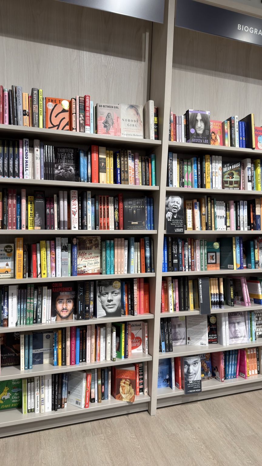 Colourful bookstore shelves photographed by Aman